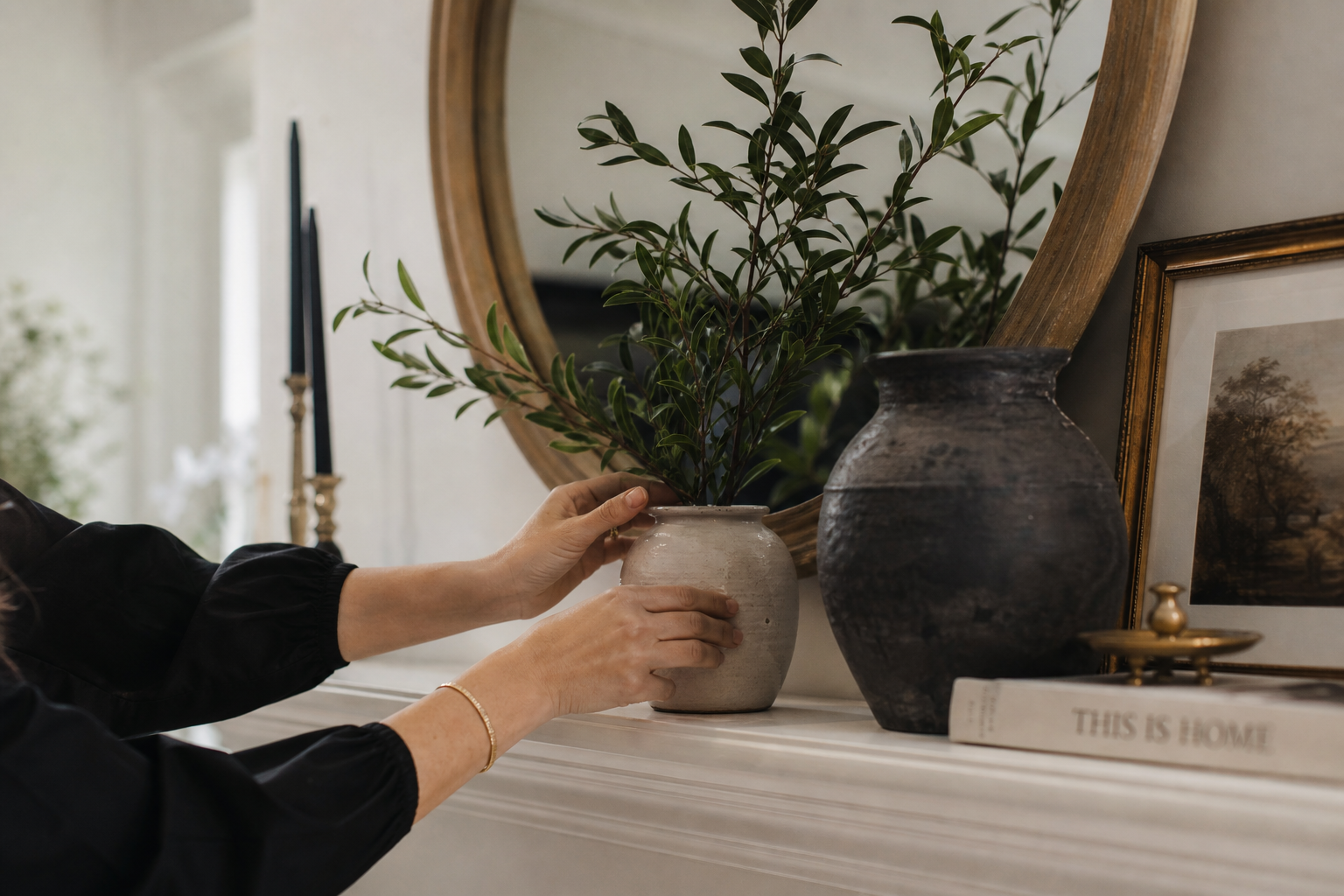 Styliste arrange branches vases